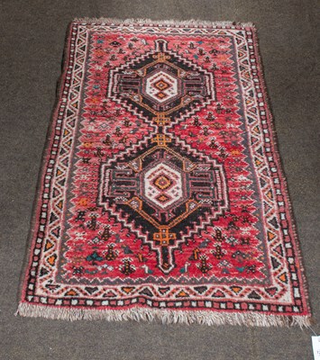 Lot 1289 - Kashgai Rug, the soft raspberry field centred...