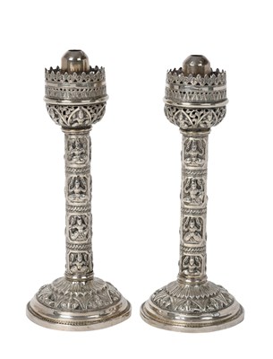 Lot 2080 - A Pair of Indian Silver Candlesticks
