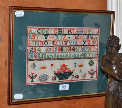 Lot 596 - Victorian wool alphabet sampler, worked by Lilian Jaques aged 12 years, 1874