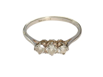 Lot 450 - A Diamond Three Stone Ring, the graduated...