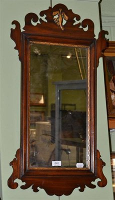 Lot 640 - A mahogany fret cut and parcel gilt mirror