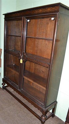 Lot 647 - Glazed oak bookcase