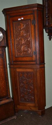 Lot 661 - Late 19th/early 20th century carved oak floor standing corner cupboard