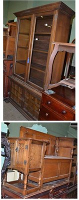 Lot 670 - Younger glazed bookcase cupboard, an oak monks bench, a small carved oak cupboard and an oak...