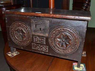 Lot 675 - A small carved oak kist, monogrammed 'DE' and dated 1683