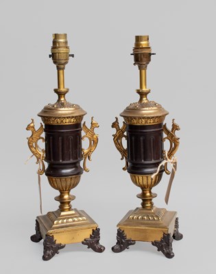 Lot 396 - A Pair of Empire Style Parcel-Gilt and...