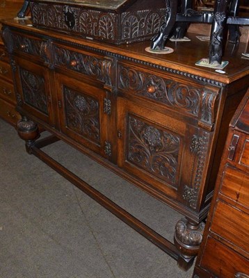 Lot 689 - Carved oak sideboard