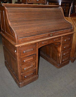 Lot 694 - Roll top desk