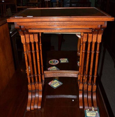 Lot 701 - A nest of four yew and mahogany tables