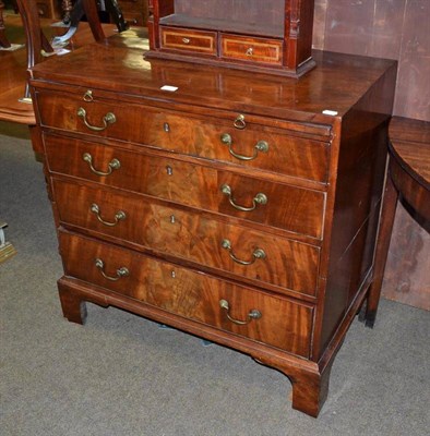 Lot 704 - A George III mahogany straight front chest of drawers, late 18th century with brushing slide...