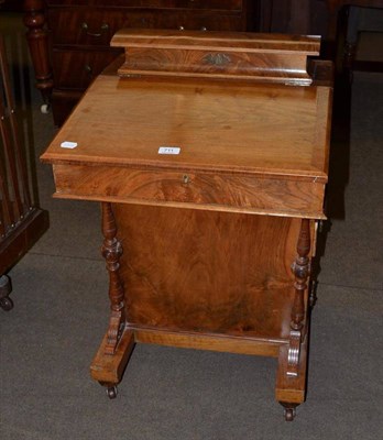 Lot 711 - A walnut Davenport