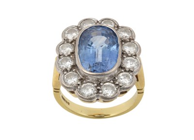 Lot 2349 - An 18 Carat Gold Sapphire and Diamond Cluster...