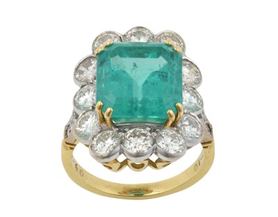 Lot 2332 - An Emerald and Diamond Cluster Ring the...