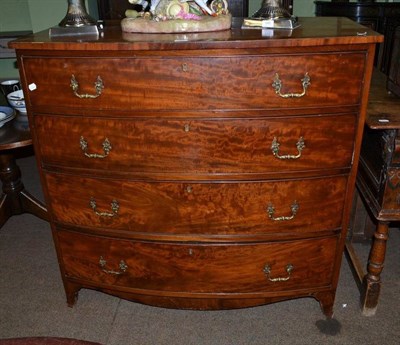 Lot 721 - A late George III mahogany bow front four height chest