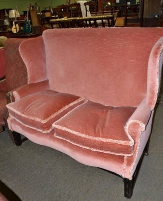 Lot 722 - Wingback mahogany framed settee