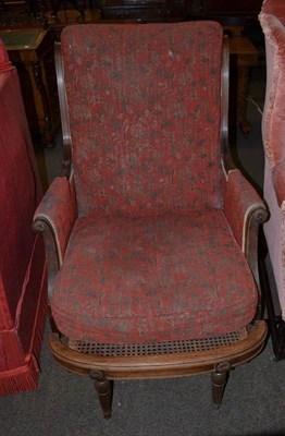 Lot 723 - Mahogany framed armchair with cane pull-out foot rest