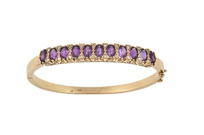 Lot 2337 - A 9 Carat Gold Amethyst and Diamond Bangle...