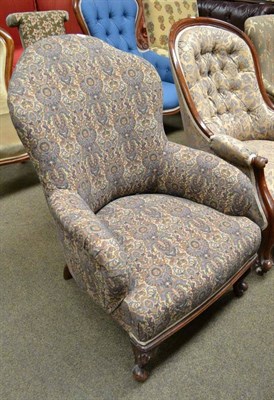 Lot 733 - A Victorian upholstered easy chair on carved mahogany legs