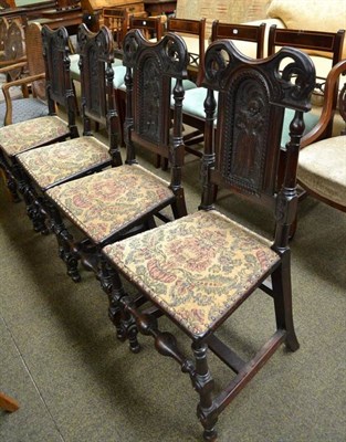 Lot 743 - Four carved oak panel back chairs