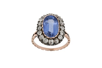 Lot 2346 - A Sapphire and Diamond Cluster Ring the oval...