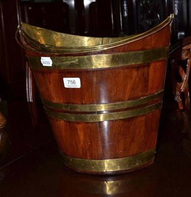 Lot 756 - Mahogany oval brass bound bucket and liner