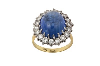 Lot 2280 - A Sapphire and Diamond Cluster Ring the oval...