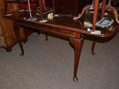 Lot 777 - Early 20th century walnut extending table