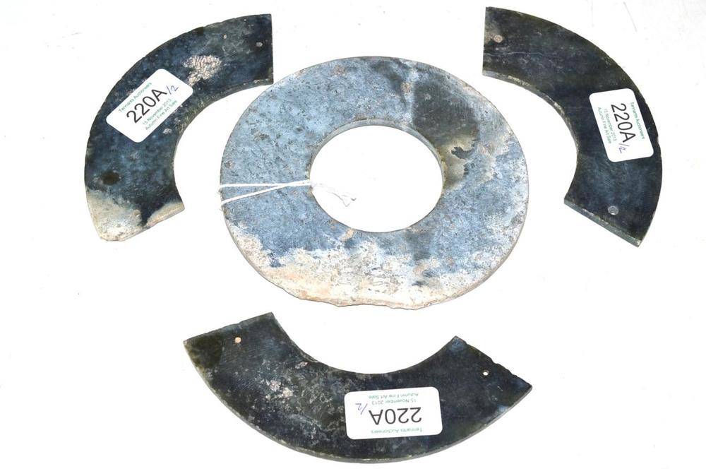 Lot 220 - A Green, Grey and Russet Hardstone Bi Disk, in Archaic style, 13cm diameter; and A Similar Disk, in