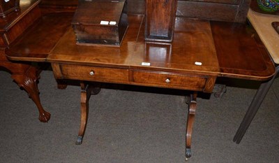 Lot 804 - A Regency mahogany sofa table, early 19th century, with twin rounded drop flaps above standard...