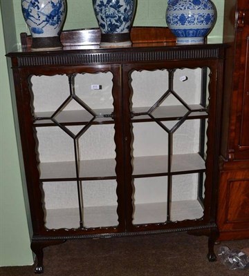 Lot 810 - An early 20th century mahogany china cabinet with double astragal glazed doors, shelved interior on