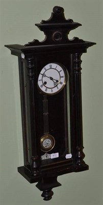 Lot 812 - An ebonized wall clock