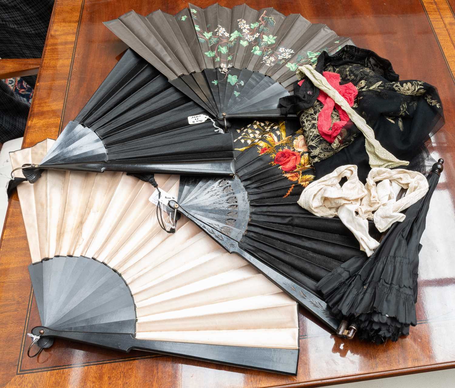 Lot 1046 - Four Early 20th Century Black Mourning Fans...