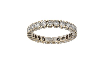 Lot 2323 - A Diamond Eternity Ring the twenty-four round...
