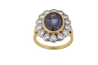 Lot 2282 - A Tanzanite and Diamond Cluster Ring the oval...