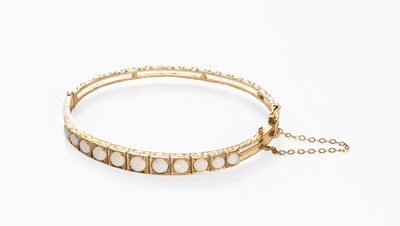 Lot 46 - A 9 Carat Gold Opal Bangle, the graduated...