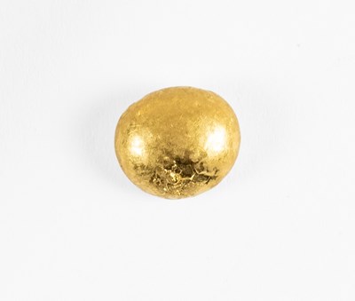 Lot 129 - A Yellow Metal Bead, diameter 0.9cm