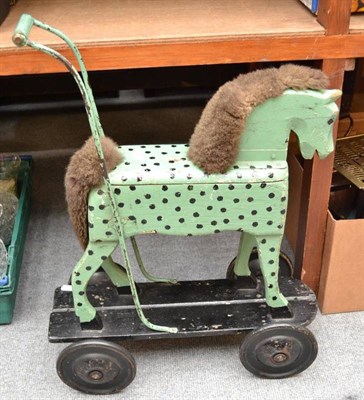 Lot 919 - Green and black painted wood push horse