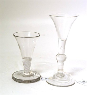 Lot 8 - A Wine Glass, 18th century, the drawn trumpet bowl with basal air tear, on a knopped stem and domed