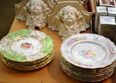 Lot 21 - A pair of Parian cherub brackets, six green ground porcelain dessert plates and eight floral...