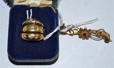 Lot 48 - Two 18ct gold rings, a 9ct gold ring and a bar brooch