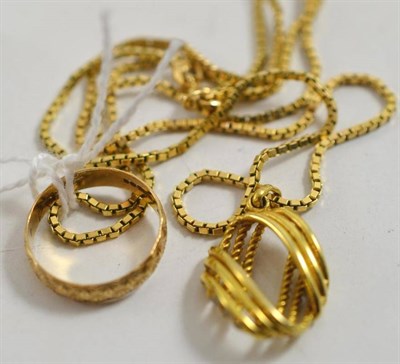 Lot 49 - A 9ct gold pendant on chain and a 9ct gold patterned band ring