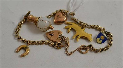 Lot 51 - A charm bracelet hung with five charms