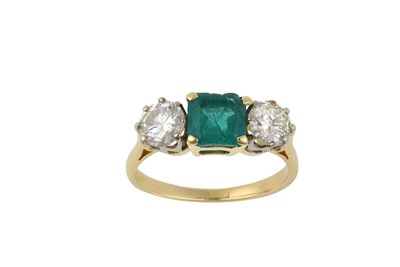 Lot 2363 - An Emerald and Diamond Three Stone Ring the...