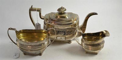 Lot 96 - George III silver three piece teaset with head crest, London 1810