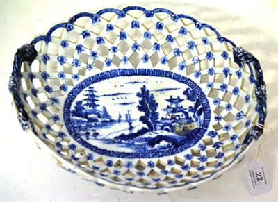 Lot 22 - A Derby Porcelain Basket, circa 1760, with ropetwist handles, painted in underglaze blue with a...