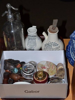 Lot 134 - A tray including pipes, two pot lids, two Dr Neson's Improved Inhalers, a water siphon, marbles etc