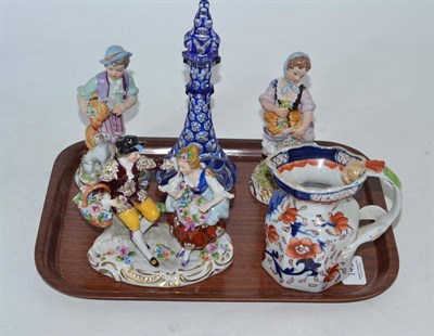 Lot 149 - An Ironstone jug and three Continental figural groups