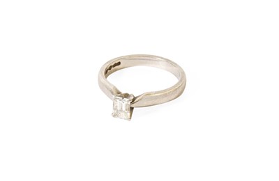 Lot 96 - A Platinum Diamond Solitaire Ring, the emerald-...