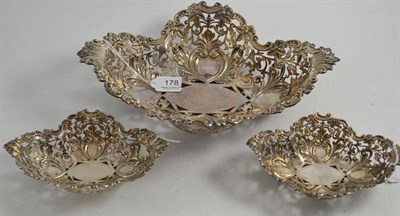 Lot 178 - Set of one large and two small ornately pierced silver baskets, Sheffield 1902