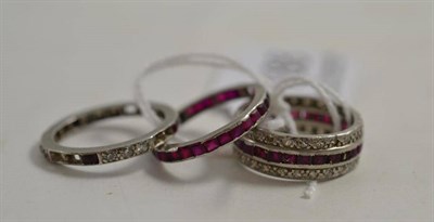 Lot 188 - Three eternity rings set with rubies and diamonds (all a.f.)